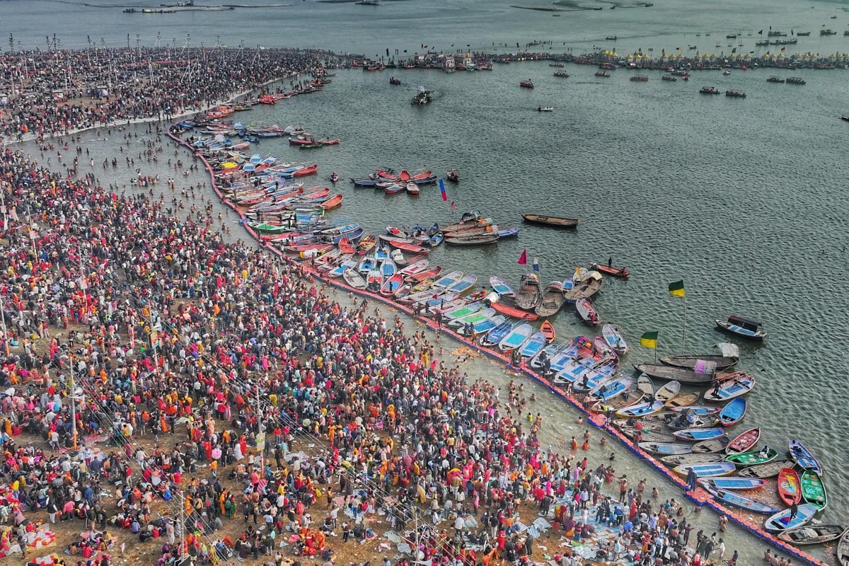 Pilgrims and boats at the Triveni Sangam, Prayagraj